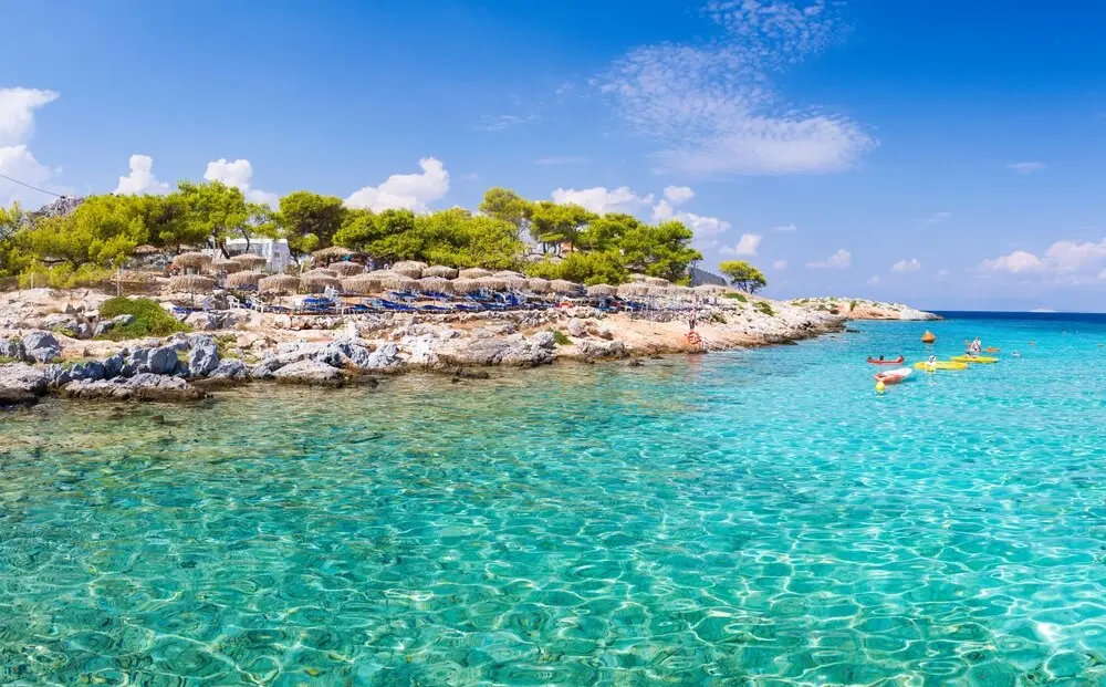 Turquoise water and pine trees on the coast of Agistri