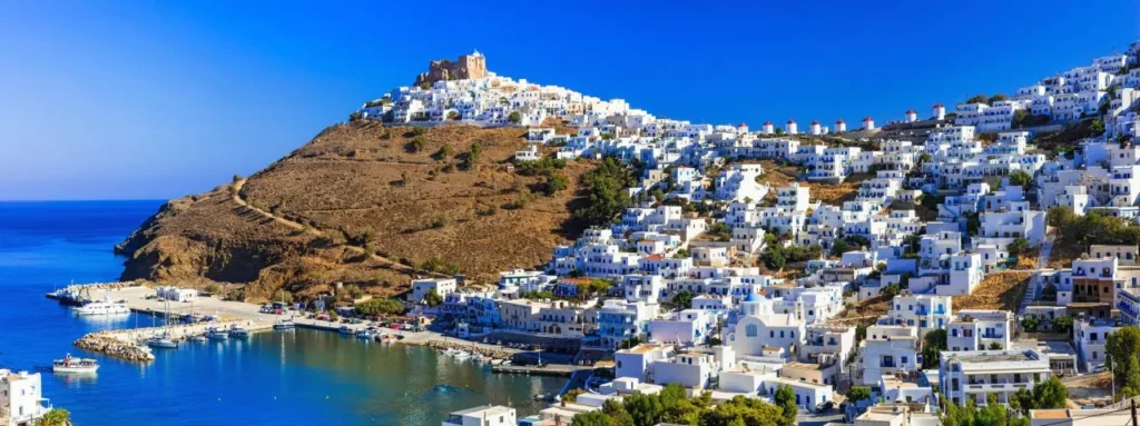 The white Chora and castle of Astypalaia above the sea